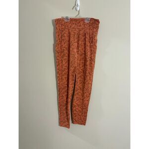 R.E.I Co-op leggings Peach colored geometric print pockets size Medium